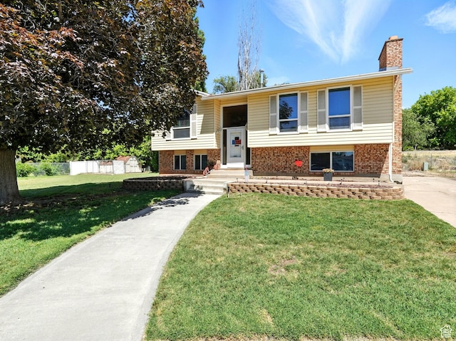 2802 W 4875 S, Roy, UT 84067 - raised ranch featuring a chimney and brick siding