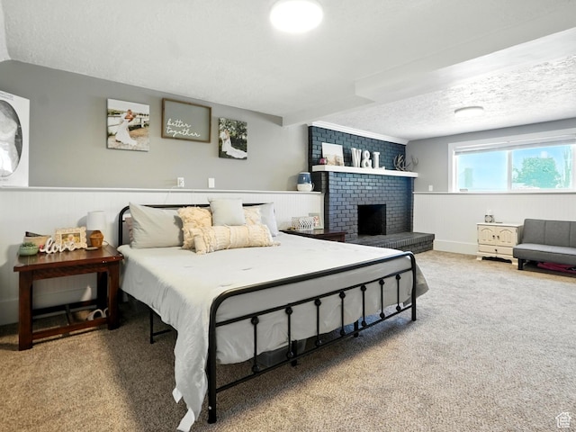 2802 W 4875 S, Roy, UT 84067 - bedroom featuring carpet floors, a textured ceiling, a fireplace, and wainscoting