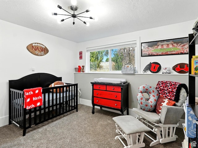 2802 W 4875 S, Roy, UT 84067 - carpeted bedroom with a chandelier, a crib, and a textured ceiling