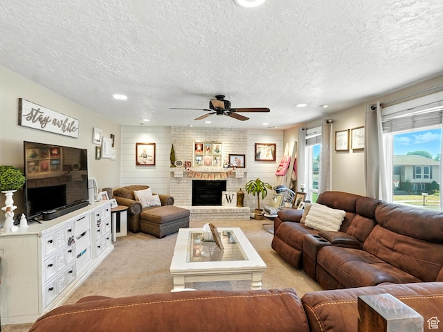 2802 W 4875 S, Roy, UT 84067 - living room featuring a textured ceiling, a ceiling fan, light carpet, a fireplace, and recessed lighting