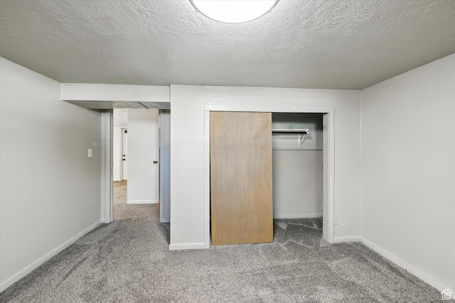 3074 W 3200 N, Benson, UT 84335 - unfurnished bedroom featuring carpet flooring, a closet, and a textured ceiling