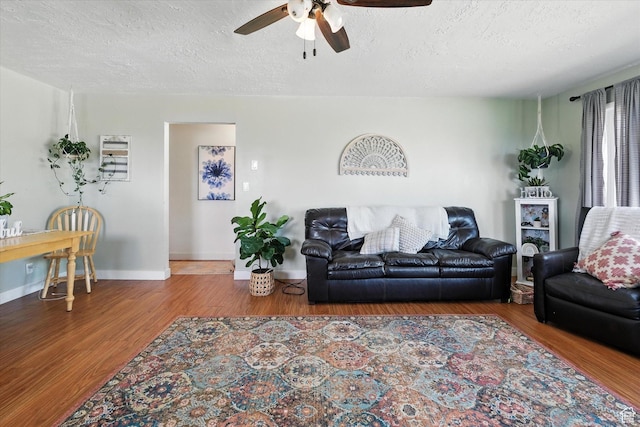 3074 W 3200 N, Benson, UT 84335 - living area with ceiling fan, a textured ceiling, and wood finished floors