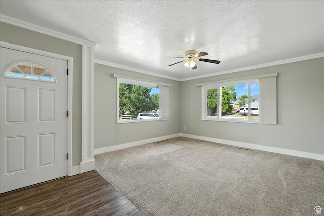 3074 W 3200 N, Benson, UT 84335 - foyer featuring a ceiling fan, ornamental molding, plenty of natural light, wood finished floors, and a textured ceiling
