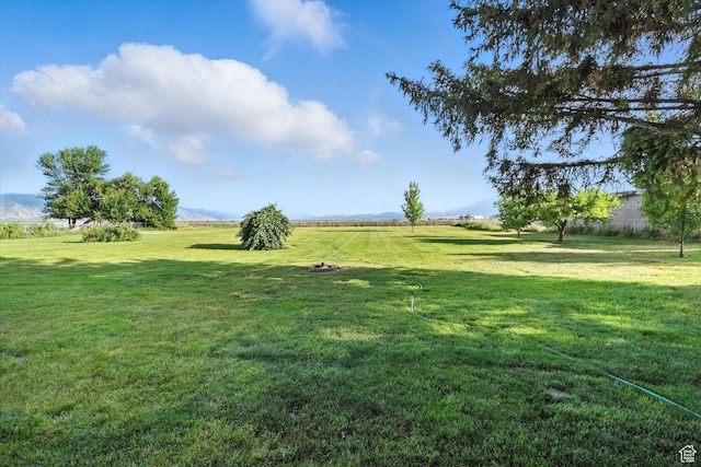 3074 W 3200 N, Benson, UT 84335 - view of grassy yard featuring a mountain view and a view of countryside