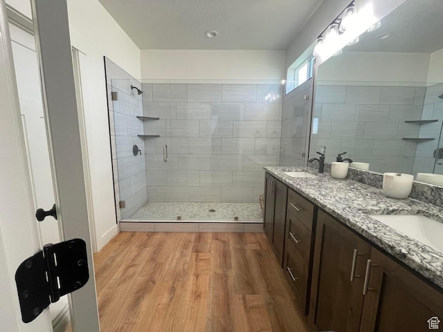 225 W 400 S, Ephraim, UT 84627 - full bath featuring a shower stall, double vanity, and wood finished floors