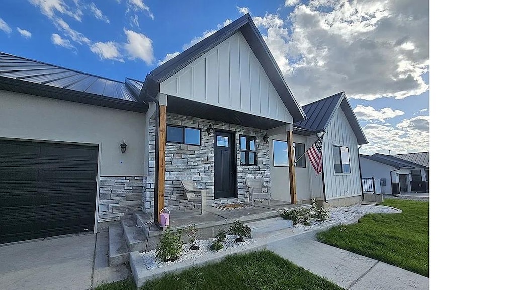 225 W 400 S, Ephraim, UT 84627 - view of front facade featuring a standing seam roof, an attached garage, and a metal roof