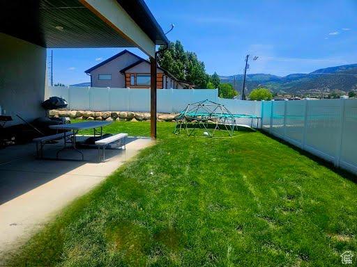 225 W 400 S, Ephraim, UT 84627 - fenced backyard featuring a mountain view and a patio area