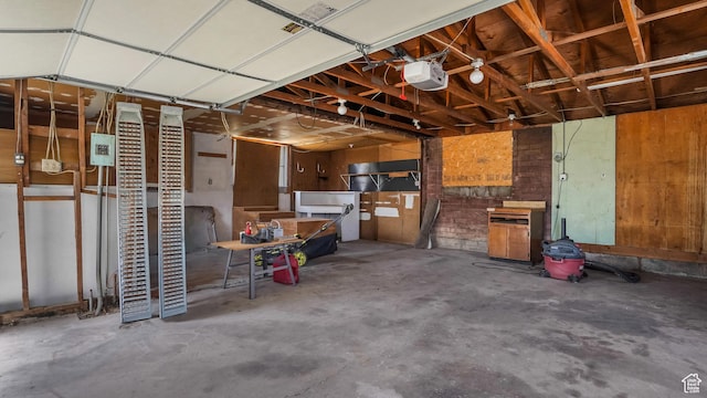 1254 Marilyn Dr, Layton, UT 84041 - garage with a garage door opener and a wood stove