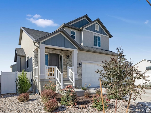 406 W Tesla Ct, Grantsville, UT 84029 - craftsman house featuring stone siding, an attached garage, board and batten siding, and stucco siding