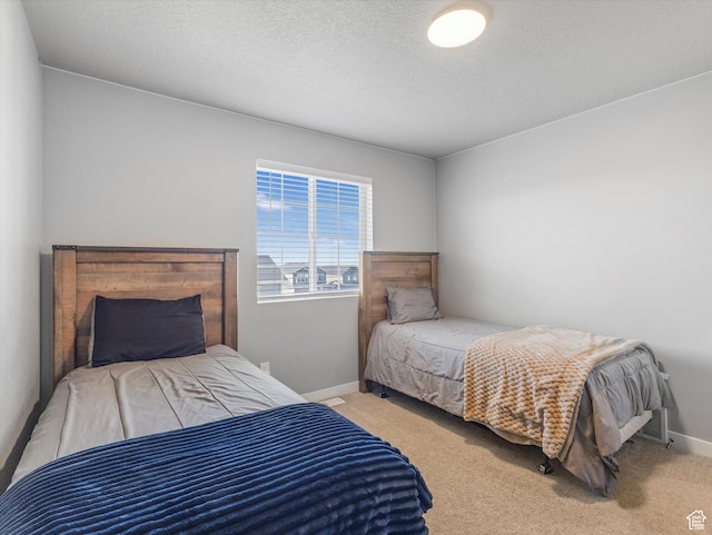 406 W Tesla Ct, Grantsville, UT 84029 - carpeted bedroom featuring baseboards and a textured ceiling