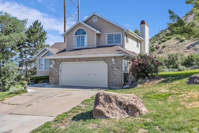 1156 E Avalon Hills Dr N, Ogden, UT 84404 - traditional-style house with a chimney, driveway, a front yard, a garage, and brick siding