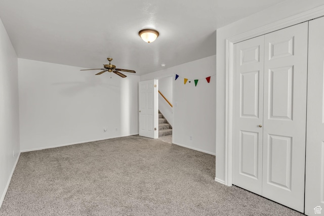 1156 E Avalon Hills Dr N, Ogden, UT 84404 - carpeted empty room with stairway and ceiling fan