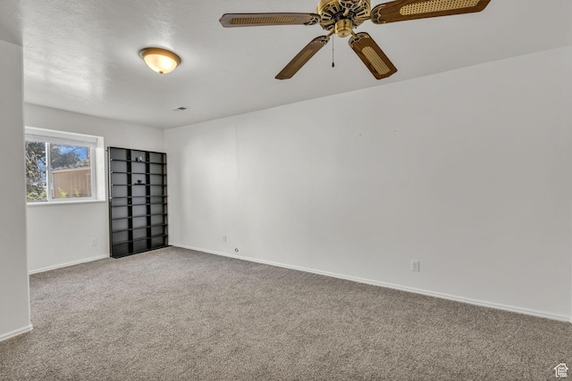 1156 E Avalon Hills Dr N, Ogden, UT 84404 - carpeted spare room featuring baseboards and ceiling fan