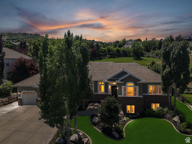 1036 E Fairway Dr, North Salt Lake, UT 84054 - view of front of home with concrete driveway, a tiled roof, and a lawn
