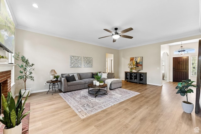1036 E Fairway Dr, North Salt Lake, UT 84054 - living area with arched walkways, ceiling fan, light wood-type flooring, baseboard heating, and ornamental molding