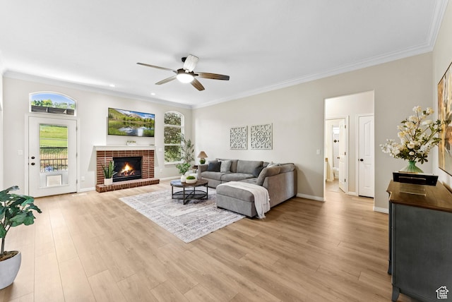 1036 E Fairway Dr, North Salt Lake, UT 84054 - living area with a ceiling fan, plenty of natural light, light wood-type flooring, crown molding, and a fireplace