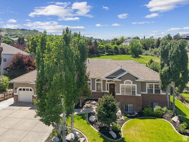 1036 E Fairway Dr, North Salt Lake, UT 84054 - view of front of property featuring brick siding, driveway, stucco siding, and a tile roof