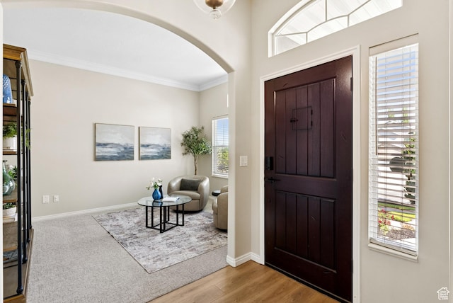 1036 E Fairway Dr, North Salt Lake, UT 84054 - foyer entrance with arched walkways, crown molding, healthy amount of natural light, and wood finished floors