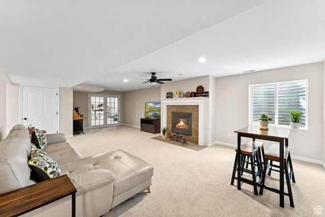 1036 E Fairway Dr, North Salt Lake, UT 84054 - living room with light carpet, a ceiling fan, a tile fireplace, and recessed lighting
