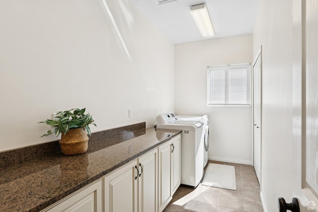 1036 E Fairway Dr, North Salt Lake, UT 84054 - laundry area featuring washer and dryer, light tile patterned flooring, and cabinet space