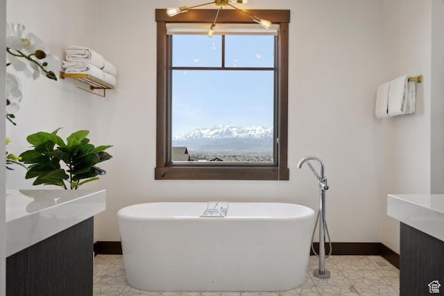 1467 N Chimney Rock Rd, Heber City, UT 84032 - bathroom with healthy amount of natural light, a freestanding tub, and vanity