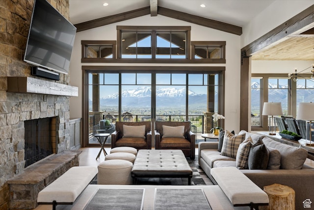 1467 N Chimney Rock Rd, Heber City, UT 84032 - living room with a mountain view, wood finished floors, a stone fireplace, a chandelier, and recessed lighting