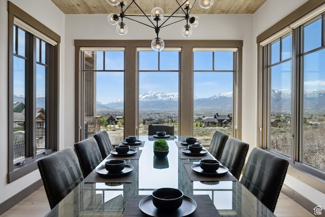 1467 N Chimney Rock Rd, Heber City, UT 84032 - dining area with a mountain view, light wood-style floors, and a chandelier