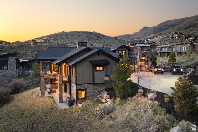 1467 N Chimney Rock Rd, Heber City, UT 84032 - view of front of property with a mountain view, concrete driveway, and stone siding