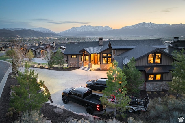 1467 N Chimney Rock Rd, Heber City, UT 84032 - back of property featuring a chimney, stone siding, a mountain view, a standing seam roof, and curved driveway