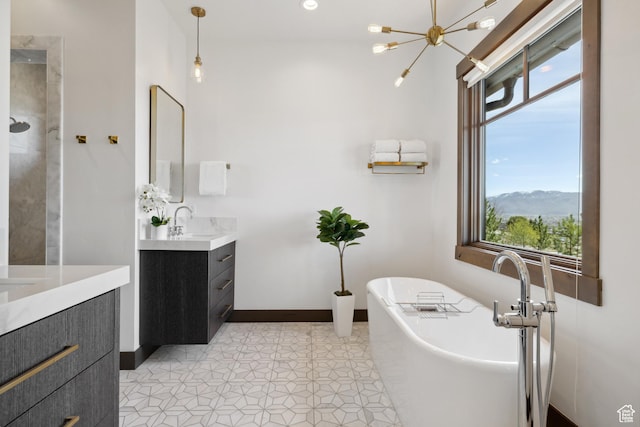 1467 N Chimney Rock Rd, Heber City, UT 84032 - bathroom with vanity, plenty of natural light, a soaking tub, and a chandelier