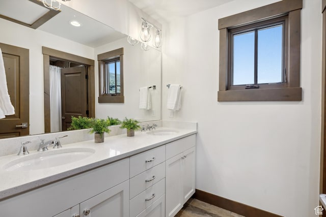 1467 N Chimney Rock Rd, Heber City, UT 84032 - full bath with double vanity, healthy amount of natural light, and recessed lighting
