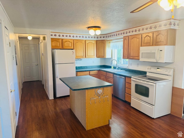 230 E 300 S, Ephraim, UT 84627 - kitchen with white appliances, dark wood-type flooring, dark countertops, a center island, and a textured ceiling