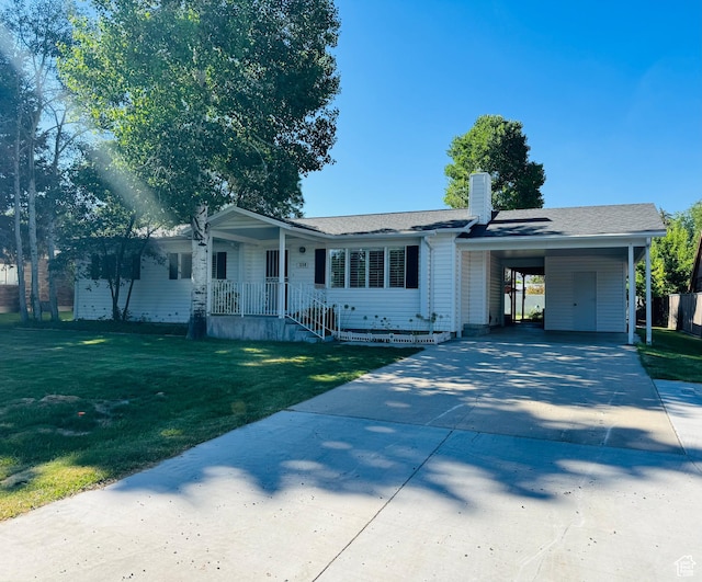 230 E 300 S, Ephraim, UT 84627 - ranch-style home featuring driveway, a front yard, a chimney, an attached carport, and a shingled roof