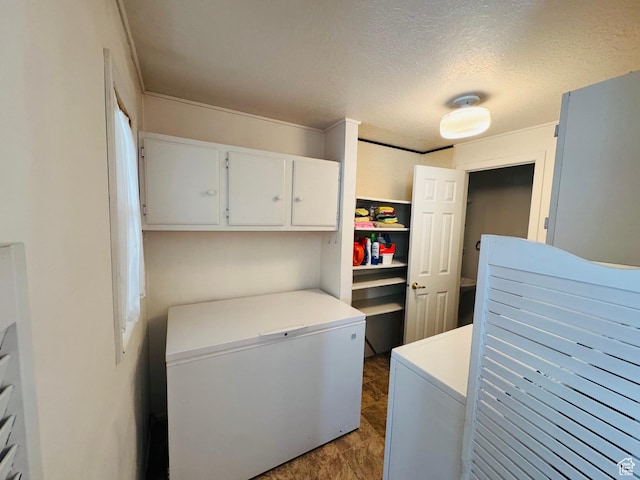 230 E 300 S, Ephraim, UT 84627 - washroom featuring separate washer and dryer, a textured ceiling, and cabinet space