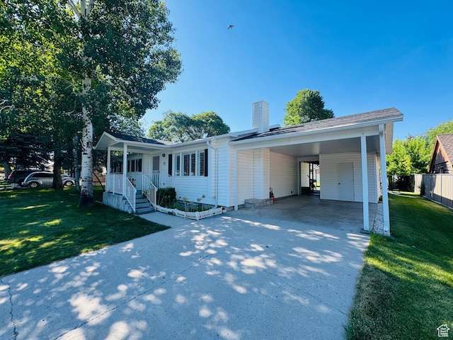 230 E 300 S, Ephraim, UT 84627 - ranch-style house with concrete driveway, a chimney, and an attached carport