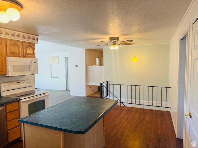 230 E 300 S, Ephraim, UT 84627 - kitchen with white appliances, dark countertops, a textured ceiling, a ceiling fan, and brown cabinets