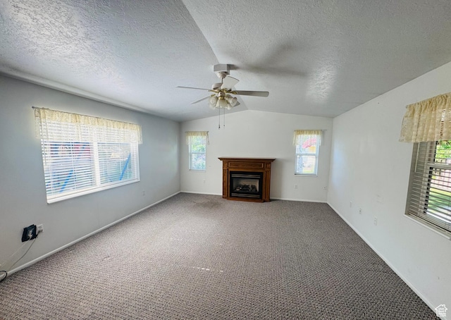 230 E 300 S, Ephraim, UT 84627 - unfurnished living room with ceiling fan, lofted ceiling, healthy amount of natural light, a fireplace, and a textured ceiling