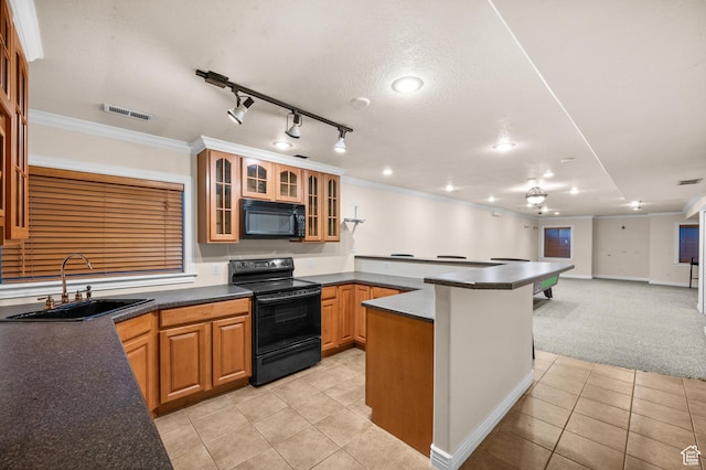 5864 Majestic Pine Dr, Murray, UT 84107 - kitchen with black appliances, light tile patterned floors, a peninsula, dark countertops, and glass insert cabinets