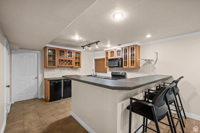 5864 Majestic Pine Dr, Murray, UT 84107 - kitchen with black appliances, a peninsula, a textured ceiling, a breakfast bar area, and crown molding