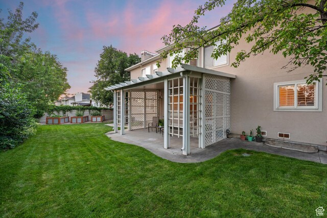 5864 Majestic Pine Dr, Murray, UT 84107 - rear view of property with stucco siding, a patio, and a yard
