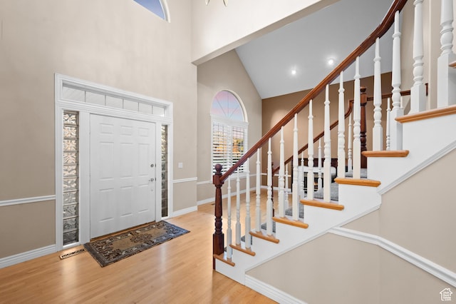 5864 Majestic Pine Dr, Murray, UT 84107 - entryway with a towering ceiling, wood finished floors, stairs, and recessed lighting