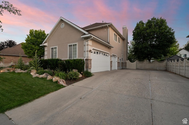 5864 Majestic Pine Dr, Murray, UT 84107 - view of side of property featuring concrete driveway, a chimney, and stucco siding