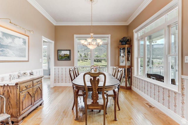 30455 N 11000 E, Fairview, UT 84629 - dining space with a chandelier, light wood-style flooring, a wainscoted wall, ornamental molding, and plenty of natural light