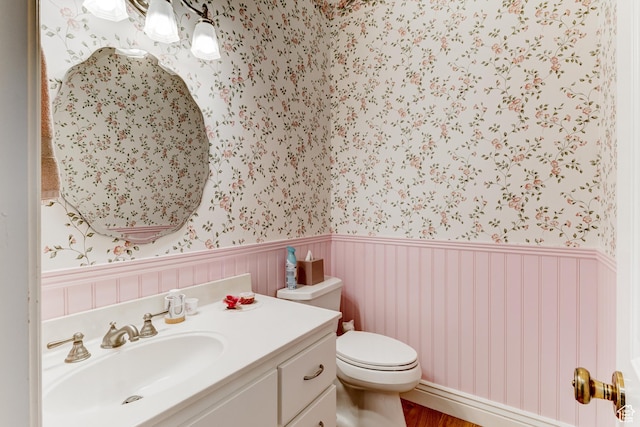 30455 N 11000 E, Fairview, UT 84629 - bathroom featuring wallpapered walls, a wainscoted wall, vanity, and wood finished floors