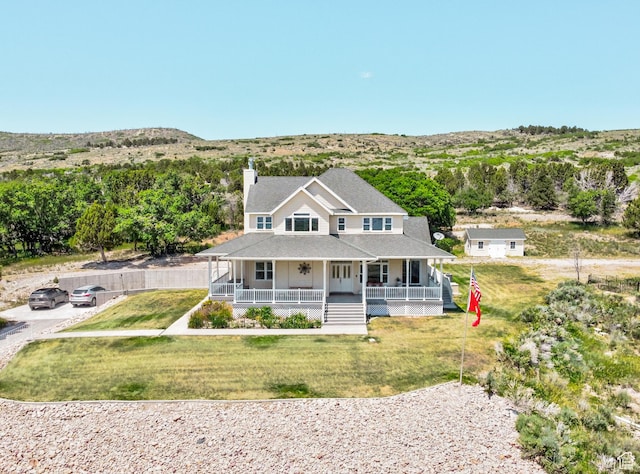 30455 N 11000 E, Fairview, UT 84629 - view of front of house with a porch, a chimney, a front lawn, and roof with shingles
