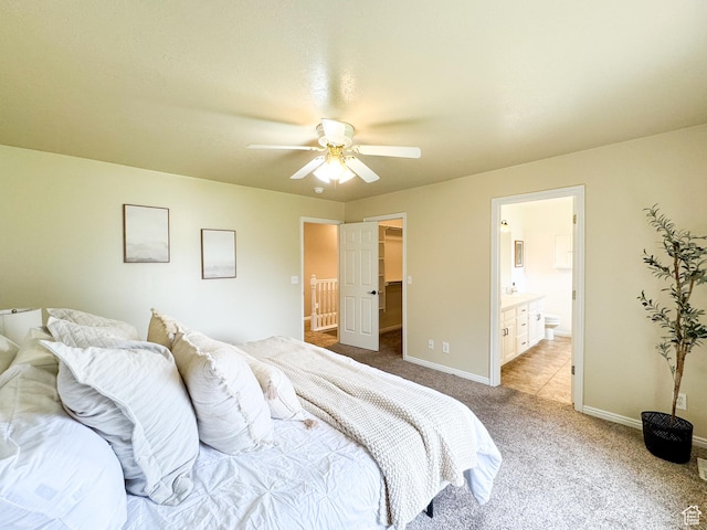 619 W 225 S, Layton, UT 84041 - bedroom featuring light colored carpet, connected bathroom, ceiling fan, and a walk in closet
