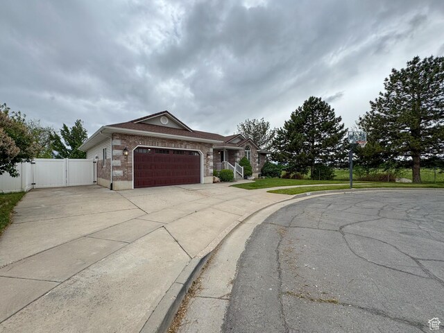 619 W 225 S, Layton, UT 84041 - single story home with a gate, driveway, a garage, and brick siding