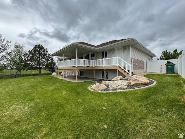 619 W 225 S, Layton, UT 84041 - rear view of house with a gate, a fenced backyard, a wooden deck, and a patio area