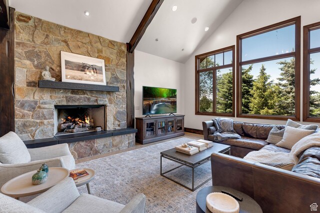 3327 E Wasatch Pines Ln, Sandy, UT 84092 - living room featuring a stone fireplace, high vaulted ceiling, beamed ceiling, and recessed lighting