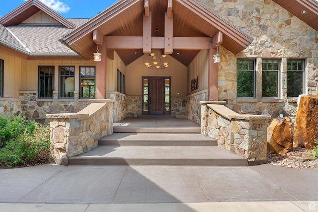 3327 E Wasatch Pines Ln, Sandy, UT 84092 - doorway to property with stone siding, roof with shingles, board and batten siding, and a porch